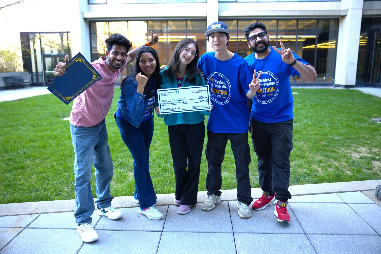 "The Five Students in Dev Dash smile and celebrate for the camera"