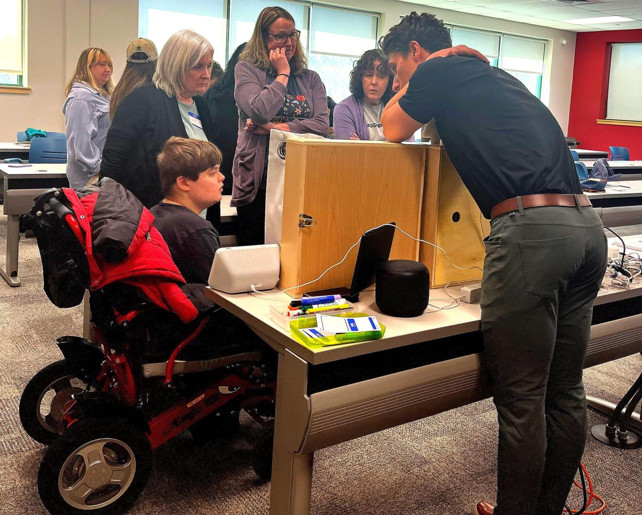 Participants look on as Redpenning demonstrates adaptive gaming strategies
