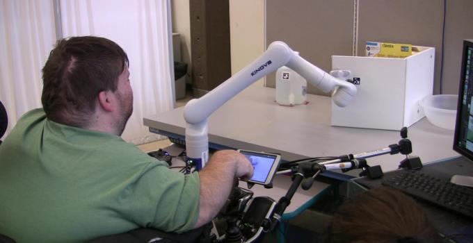 Image of a person using a robotic manipulator