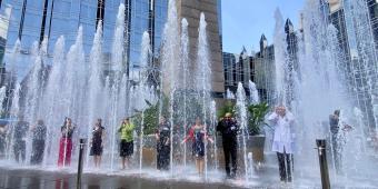 Dr. Dan Ding gets 'soaked' in the PPG fountain for the ALS Association