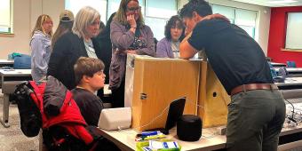 Participants look on as Dr. Redpenning demonstrates adaptive gaming strategies