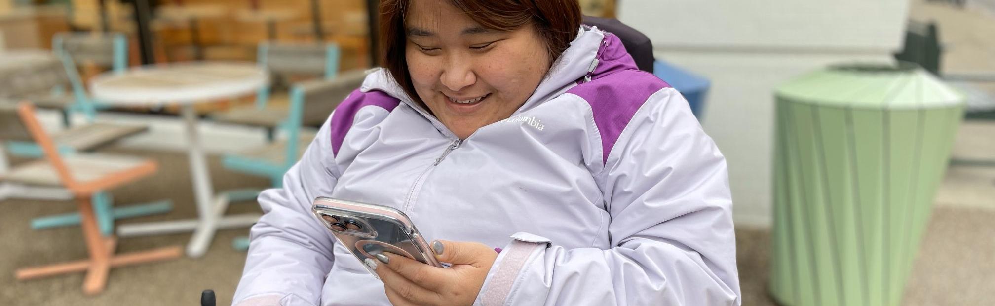 Photo of a person using a smartphone
