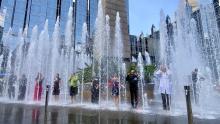 Dr. Dan Ding gets 'soaked' in the PPG fountain for the ALS Association